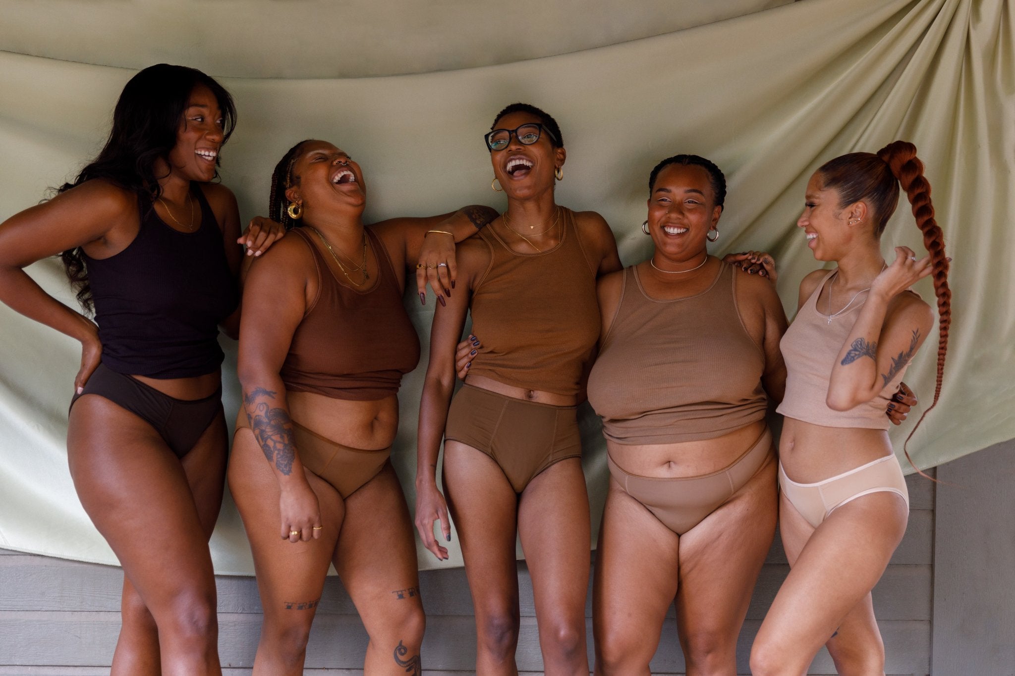 Group of melanated women wearing For The Few Intimates nude underwear in various shades — Georgia, Johnnie, Patricia, Thejuana, and Grady